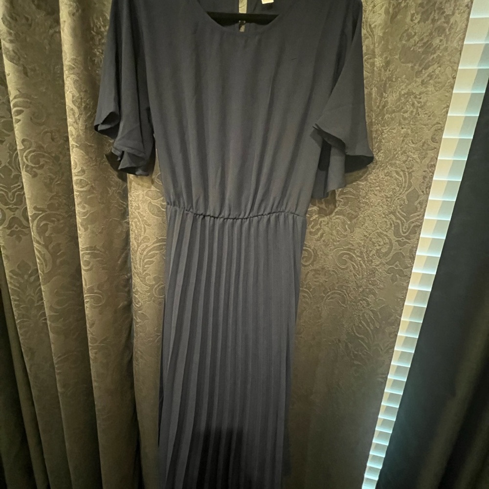 Dark navy blue below the knee dress. Never worn brand new.